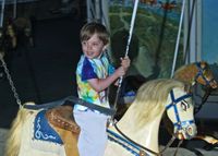 Johann on the 121 year old carousel at Watch Hill